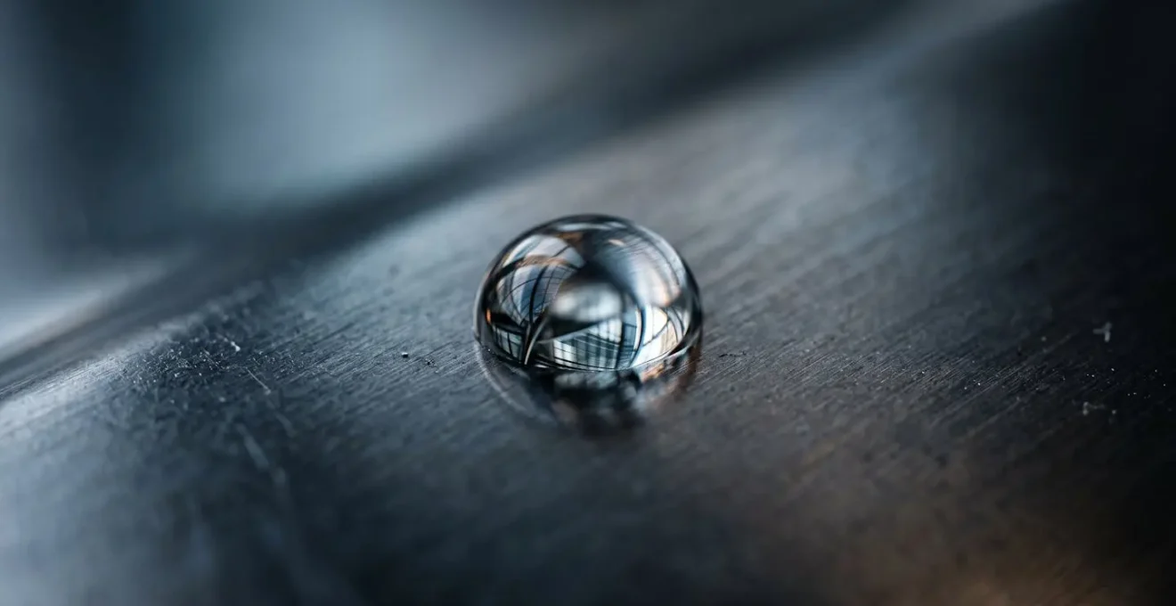 Macro detail of reflective surfaces creating abstract patterns representing intangible value