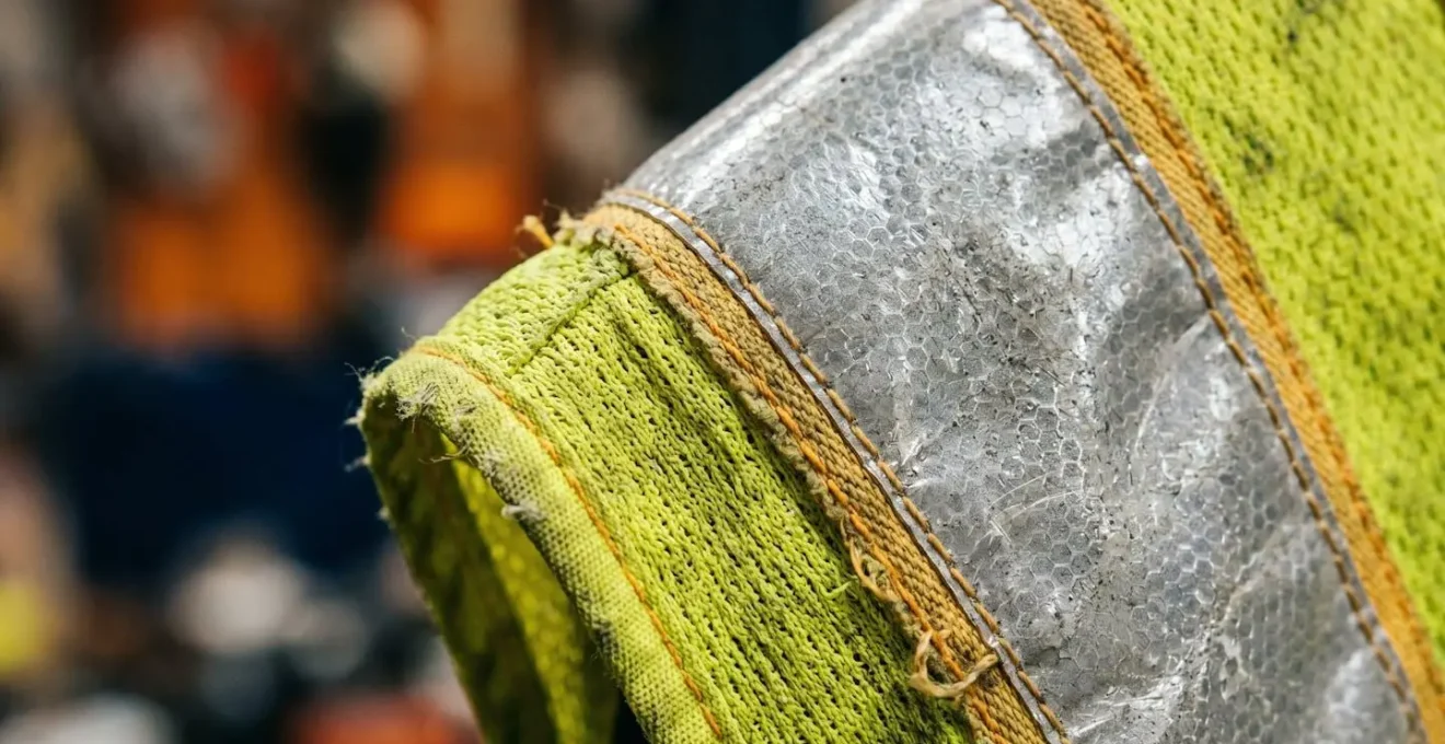 Extreme close-up macro detail of workplace safety equipment showing material texture and craftsmanship